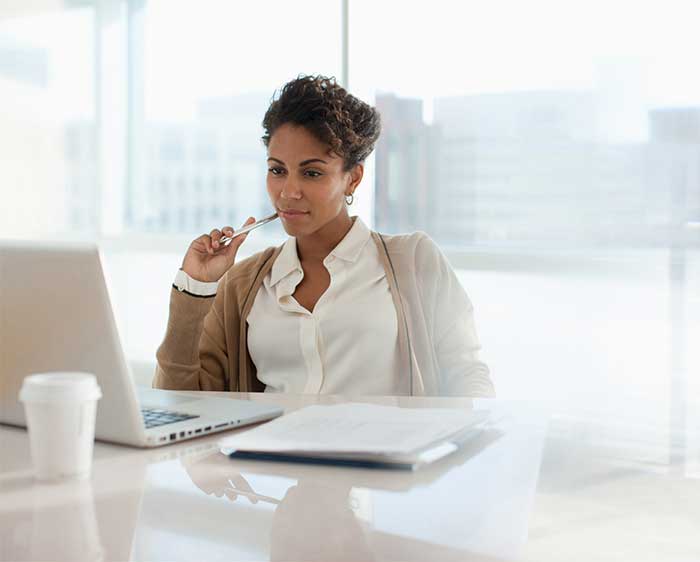 Woman sitting at a desk working.