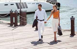 Wealthy couple walking on dock
