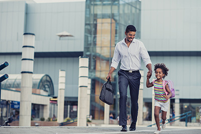 father daughter walking hand-in-hand