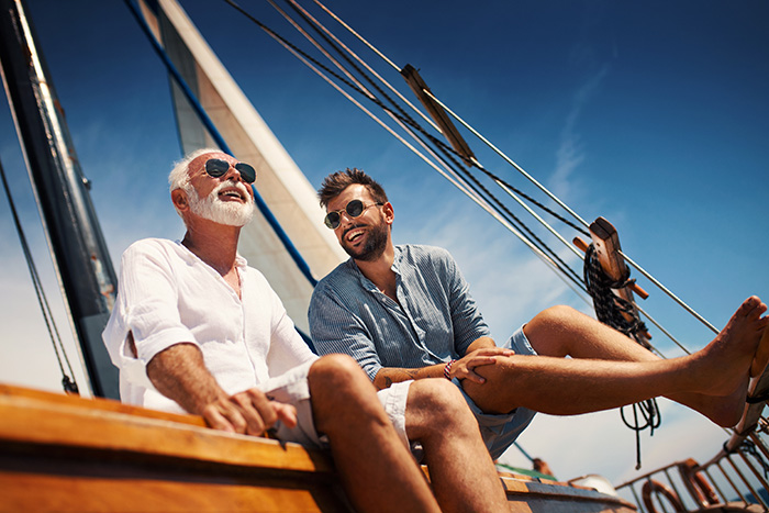 father and son on a sailboat
