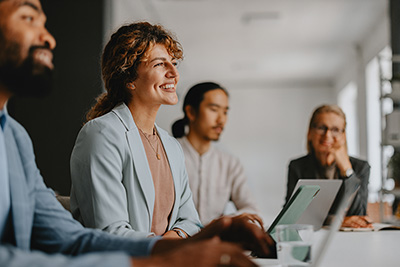female executive smiling in a meeting