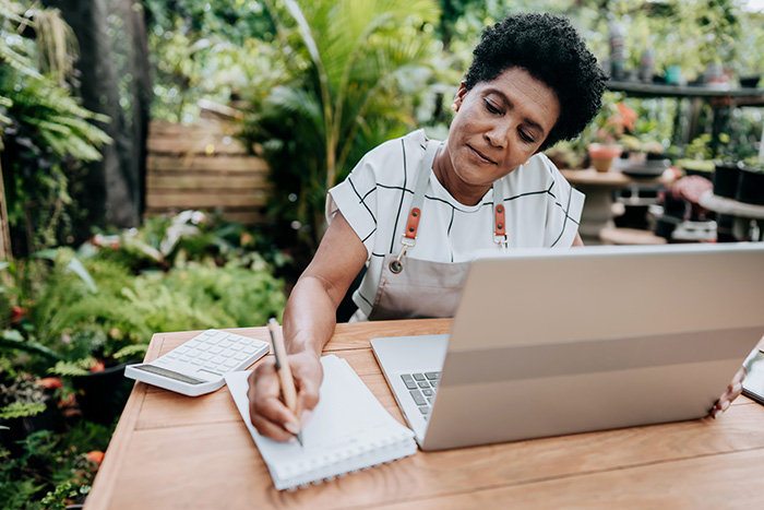 woman working on laptop in nursery